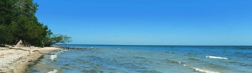 A picture of waves crashing a beach on Lake Michigan